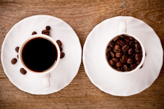 Two cups of coffee on a wooden table