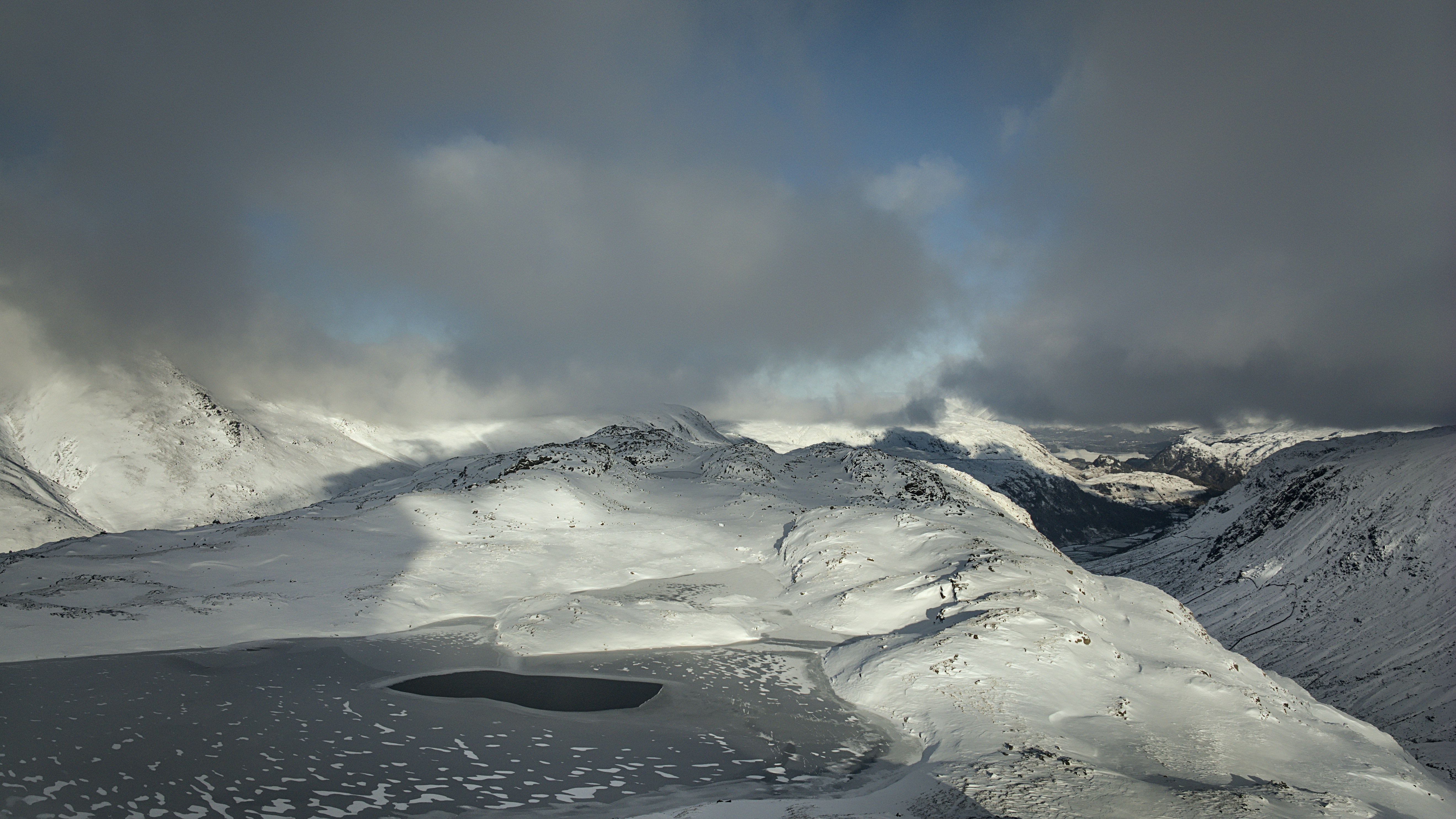 A view of a mountain range covered in snow
