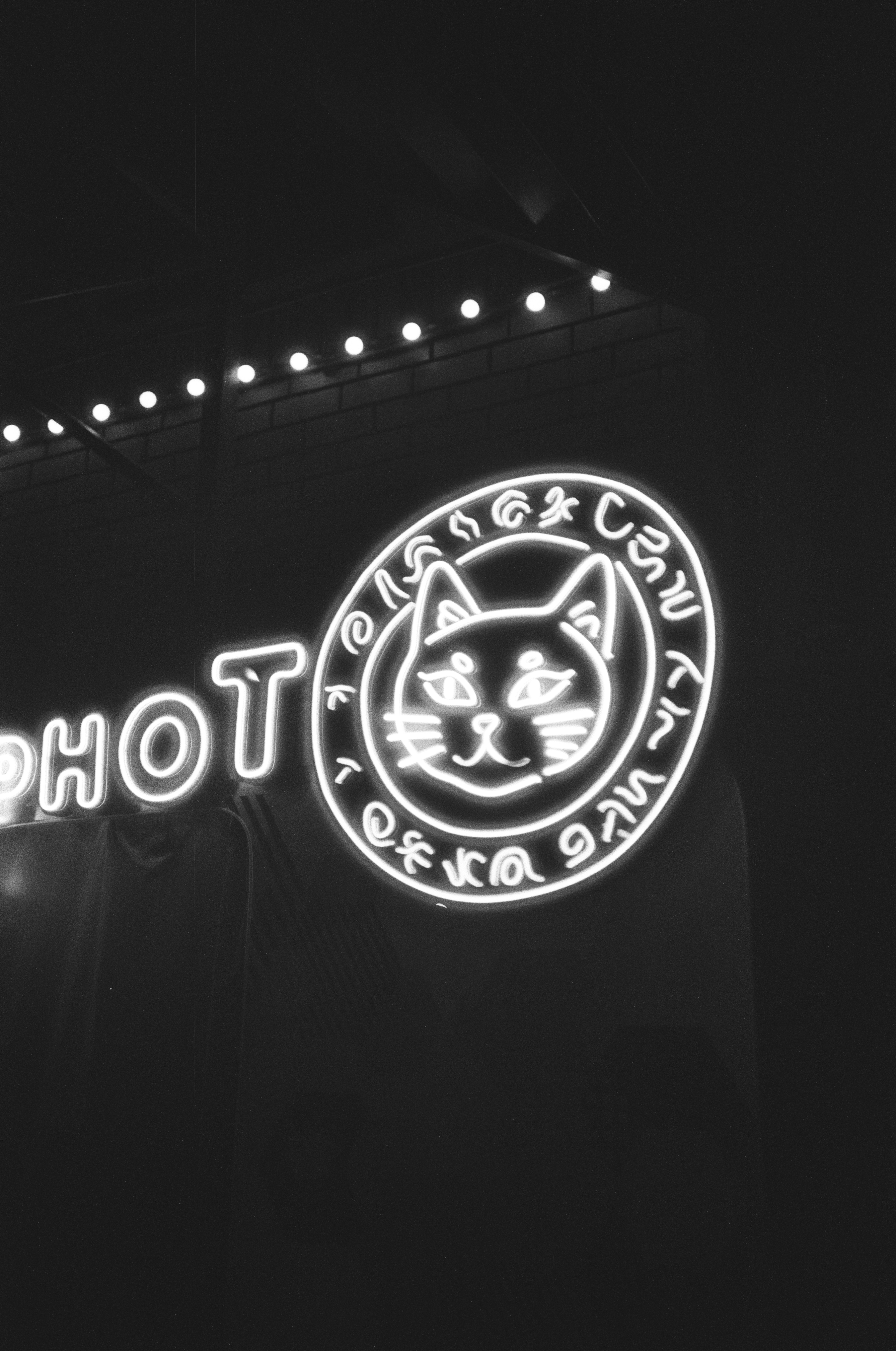 A black and white photo of a neon sign photo – Free Film Image on Unsplash