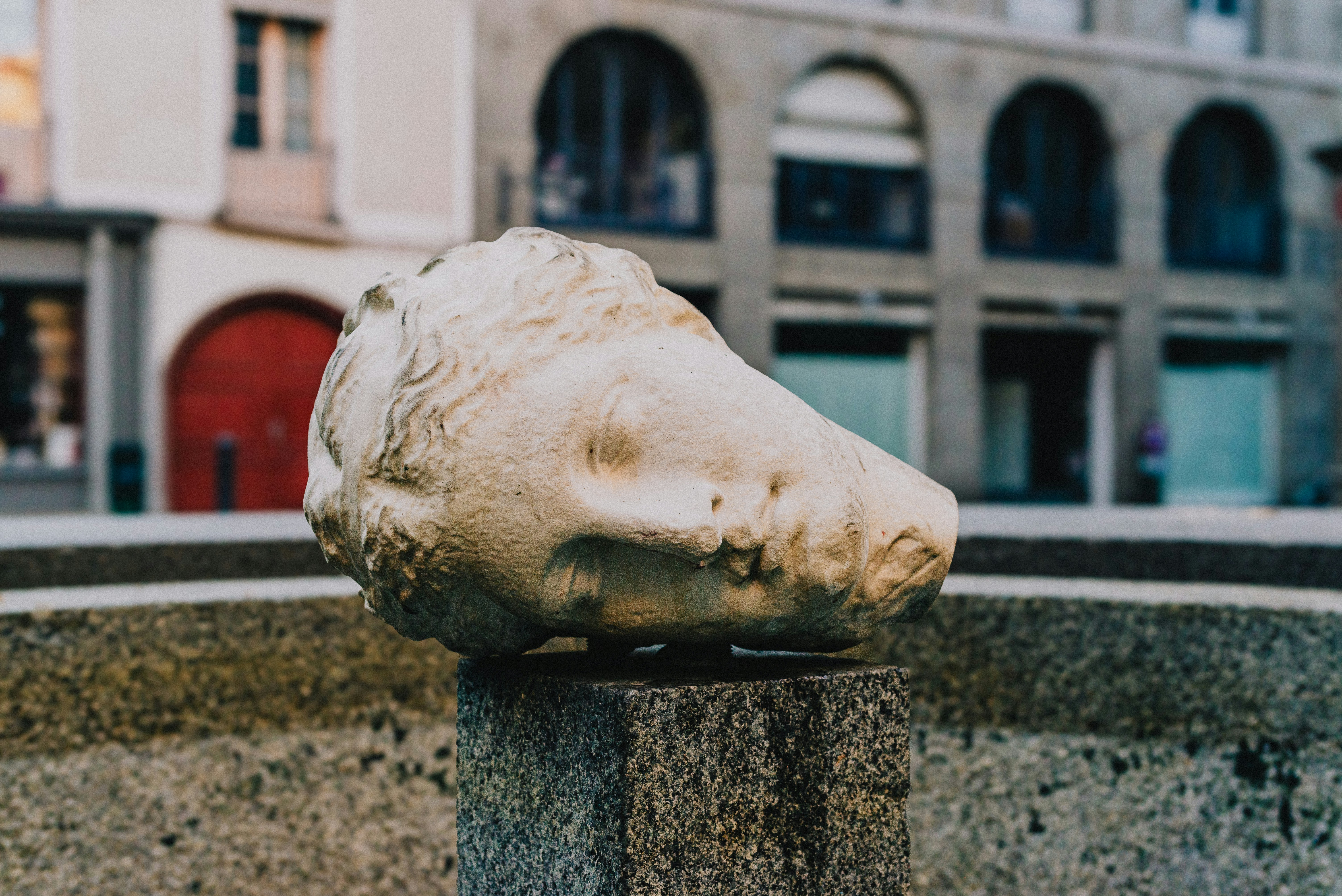A statue of a foot sticking out of a fountain