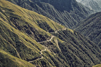 A view of a winding road in the mountains