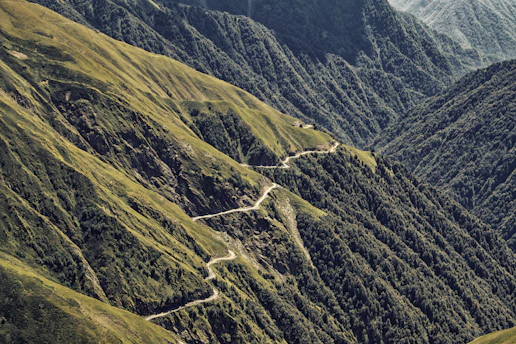 A view of a winding road in the mountains