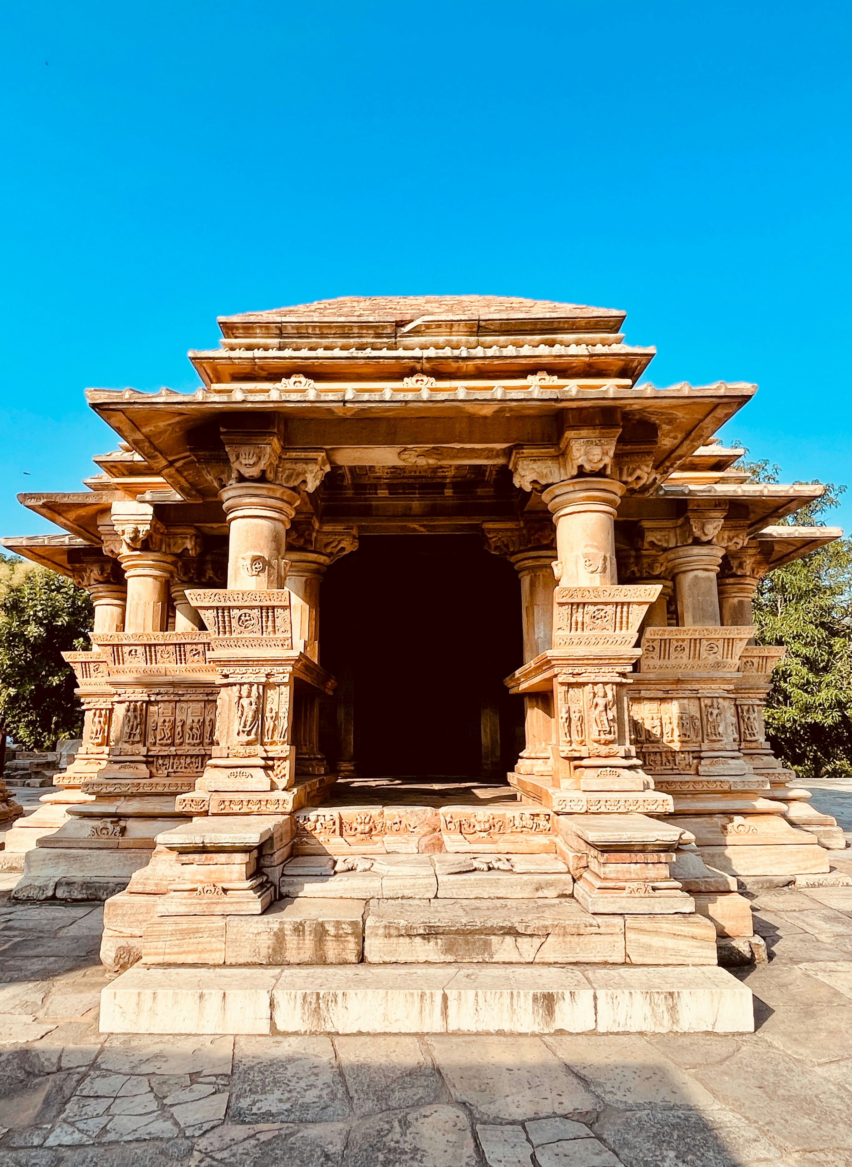 A large stone structure with pillars and pillars