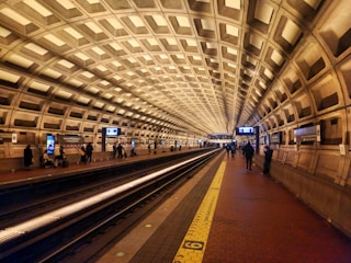 A subway station with people waiting for the train