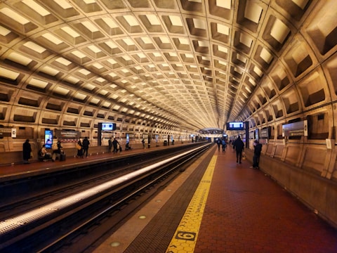 A subway station with people waiting for the train