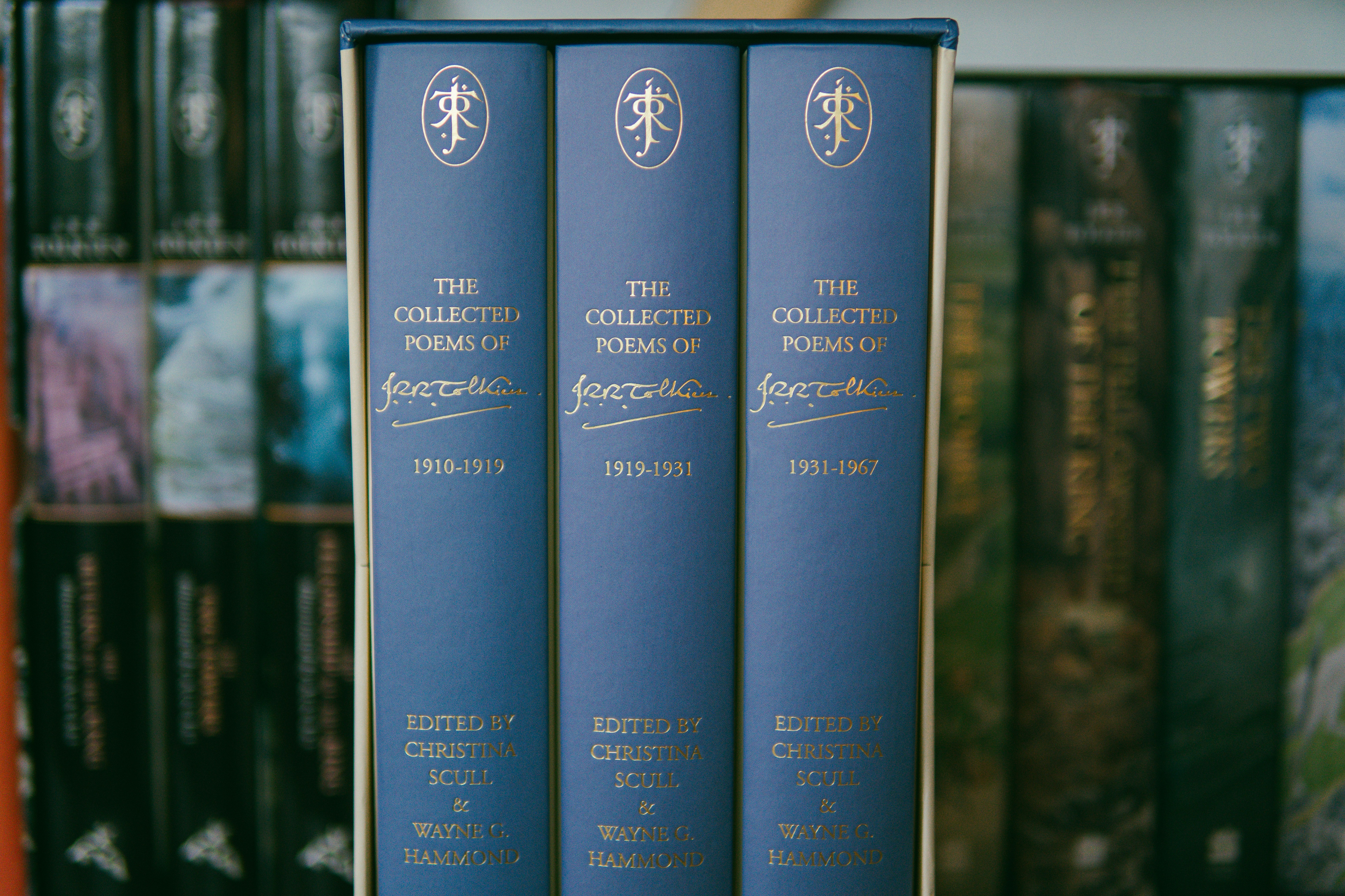 A row of books sitting on top of a shelf