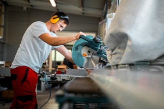A man working on a machine in a factory