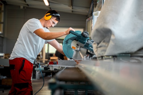 A man working on a machine in a factory