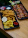 A couple of trays of food on a table