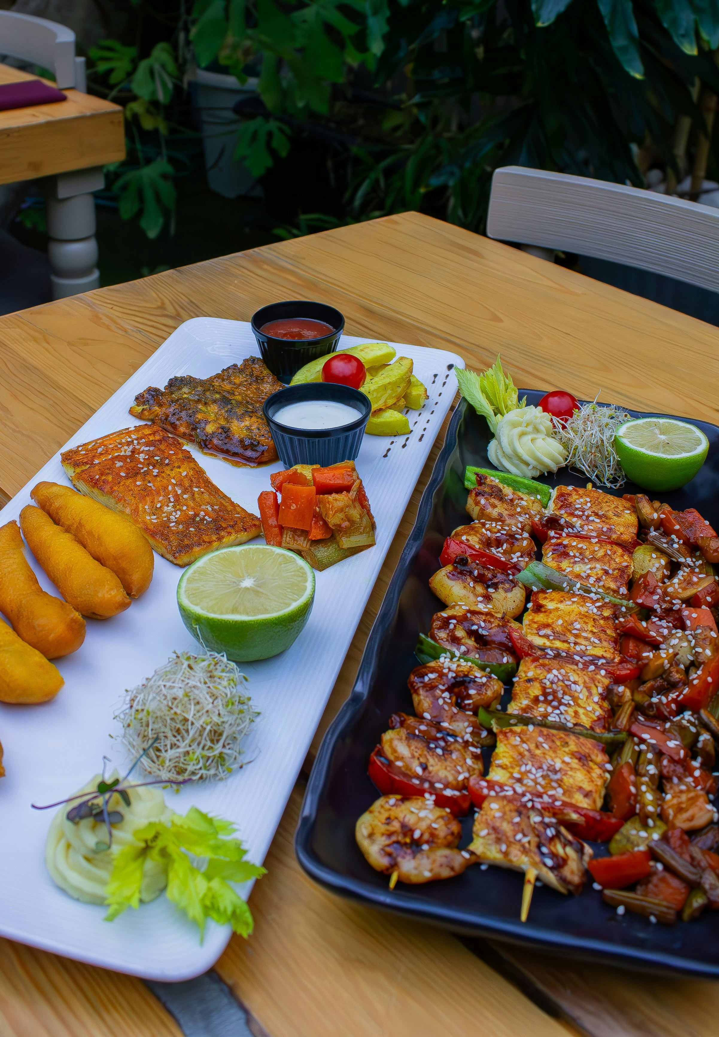 A table topped with a tray of food