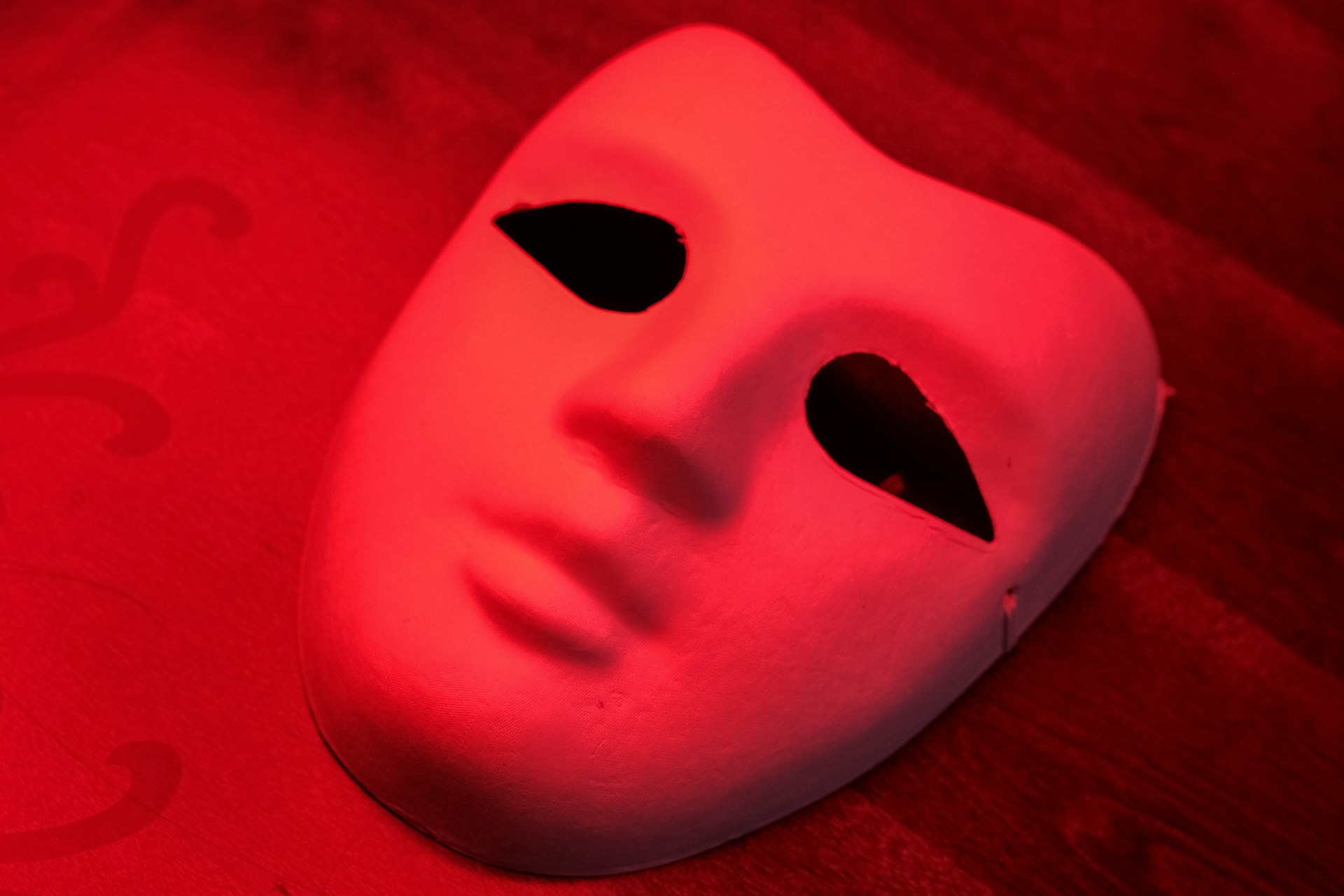 A white mask sitting on top of a table