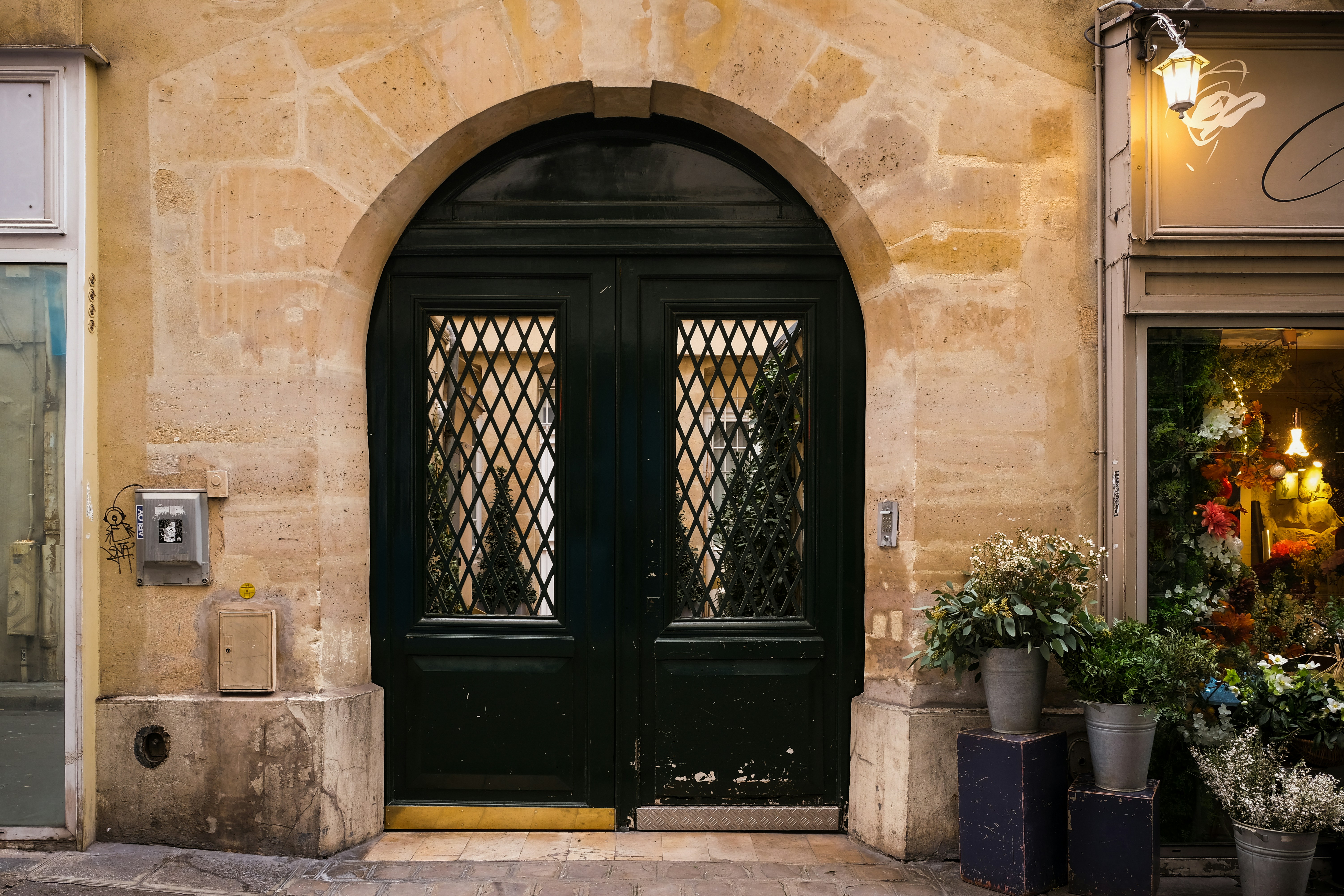 A building with a black door and a green door