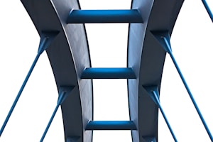 A tall blue shelf with a ladder on top of it