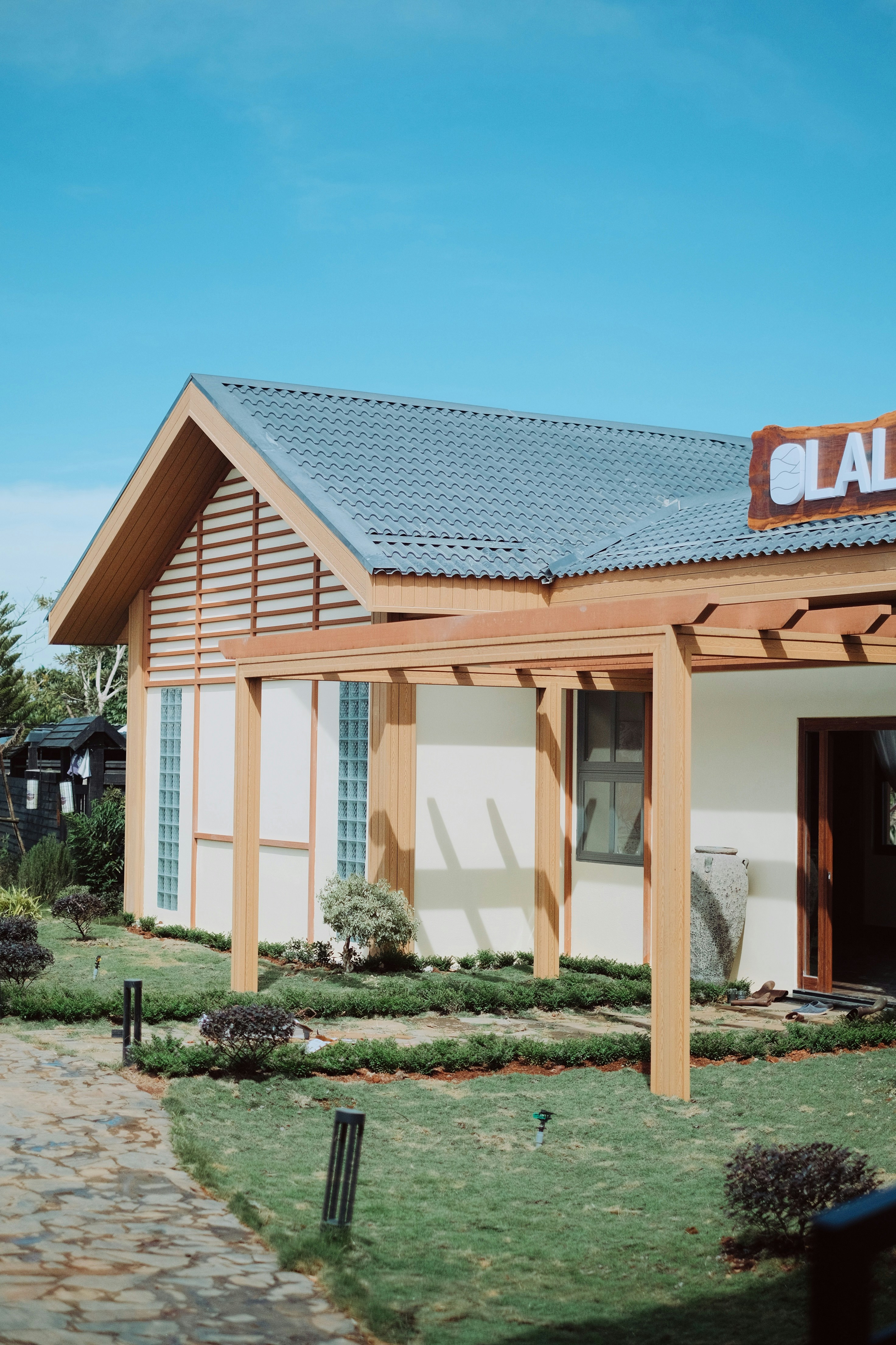 A small building with a sign on top of it