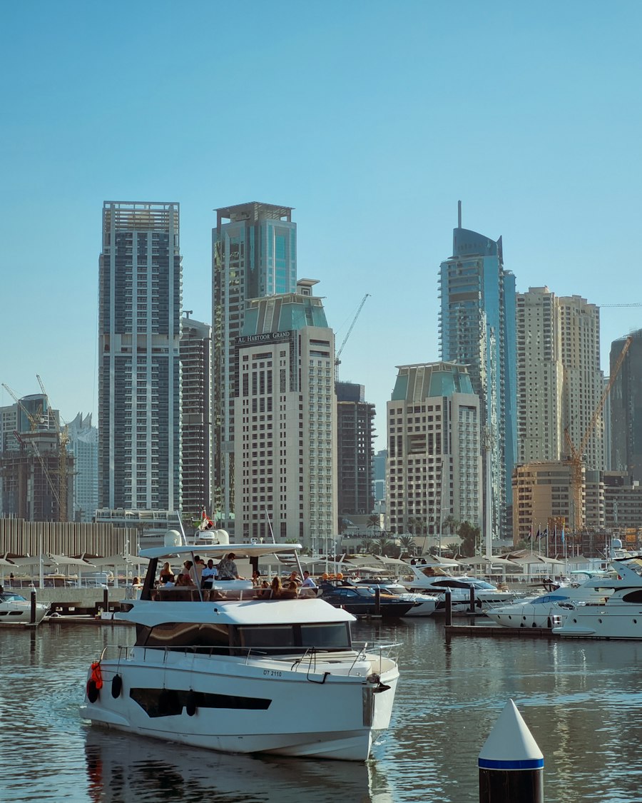 Aerial view of luxury yachts moored along the marina promenade