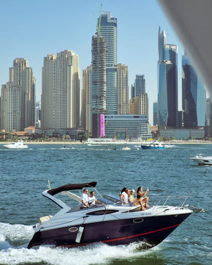 A group of people riding on the back of a boat