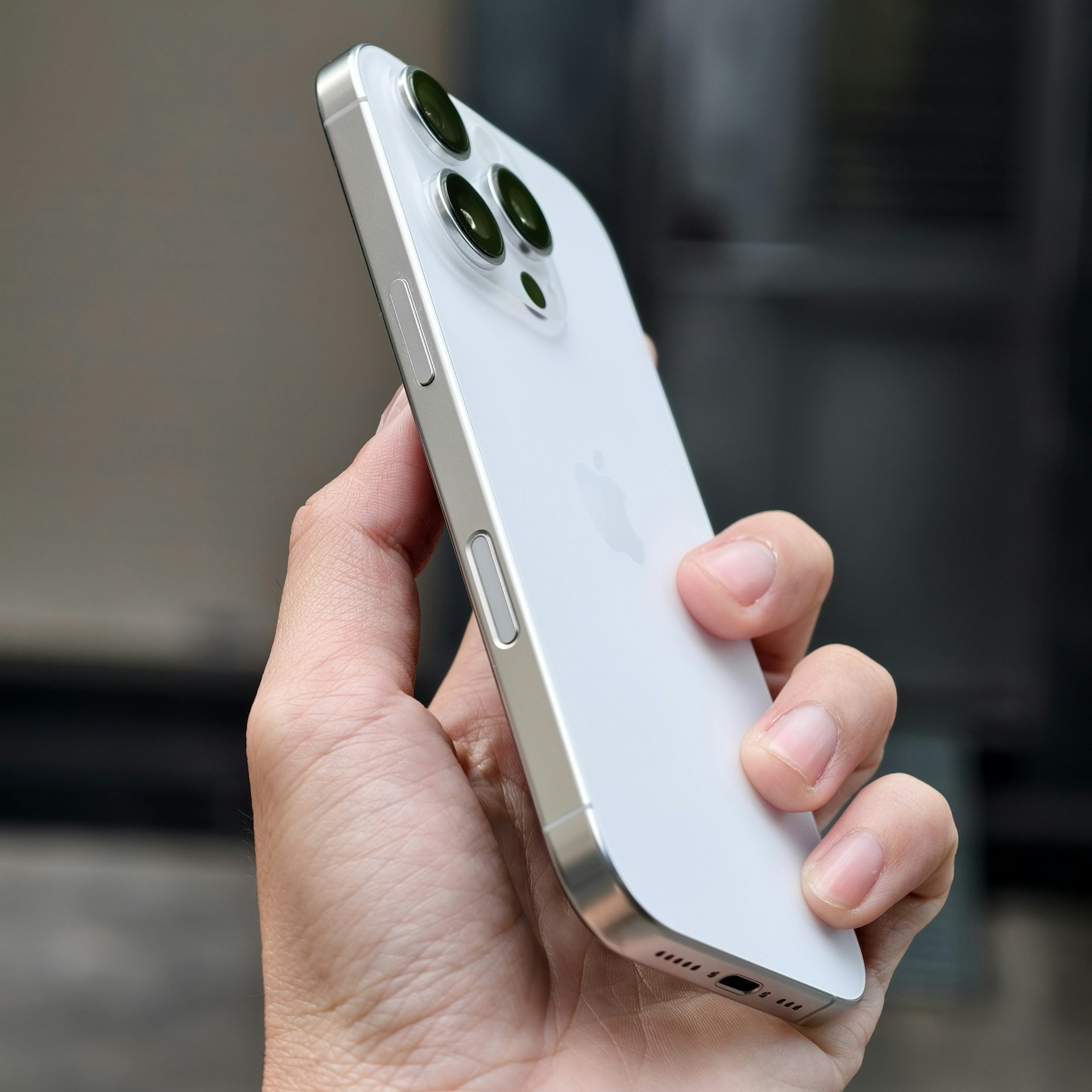 A person holding a cell phone in their hand