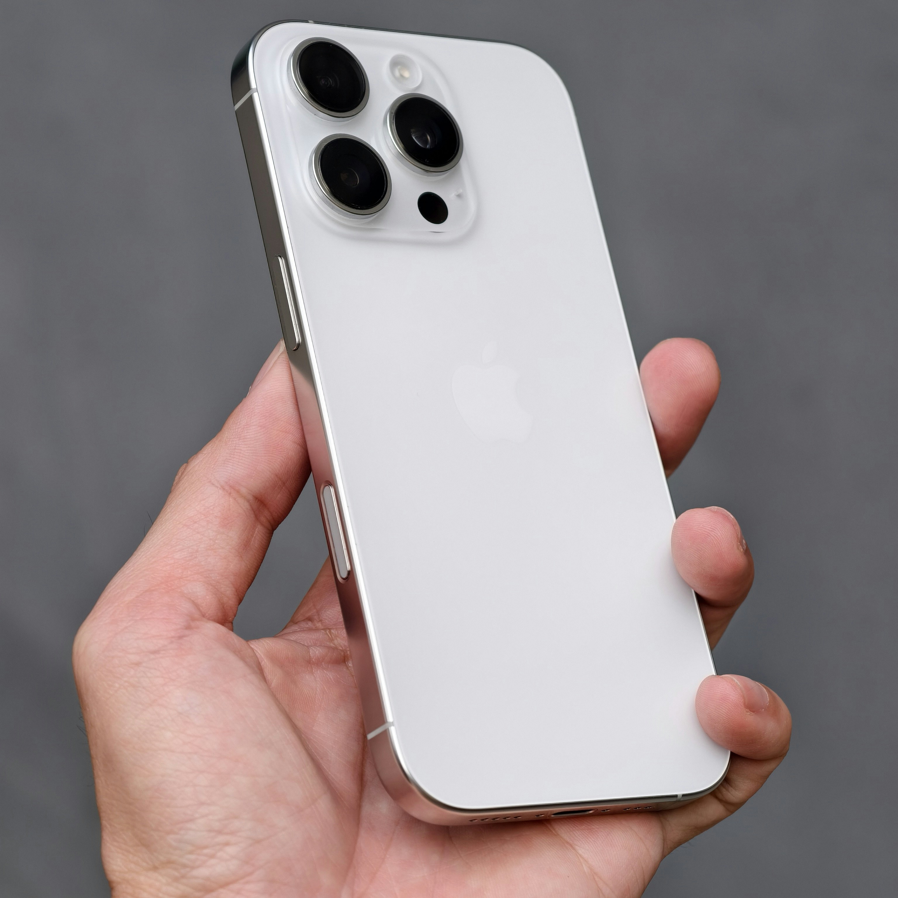 A person holding an iPhone in their hand