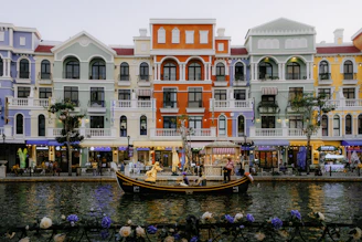 A row of buildings next to a body of water