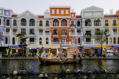 A row of buildings next to a body of water