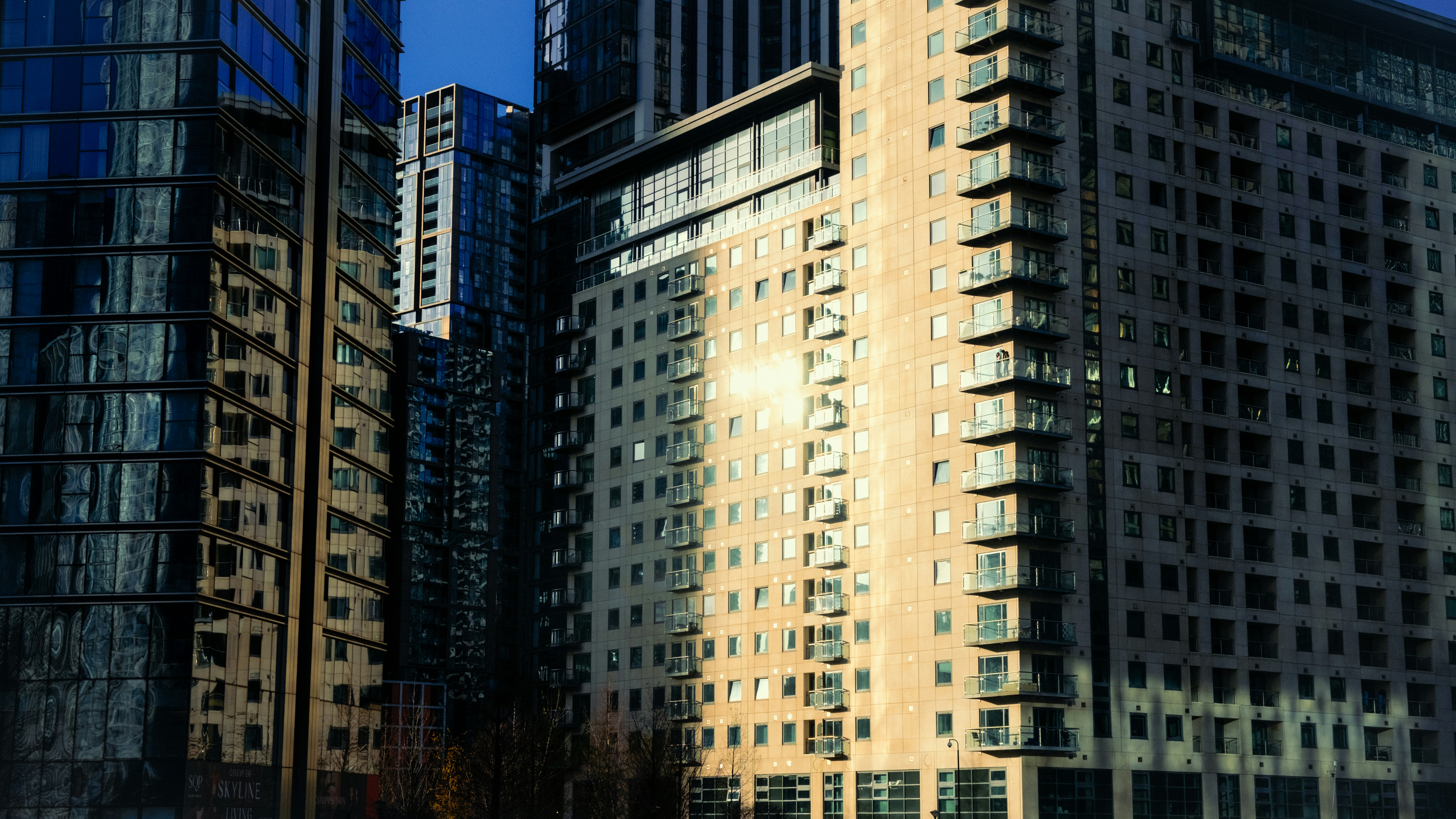 A group of tall buildings sitting next to each other
