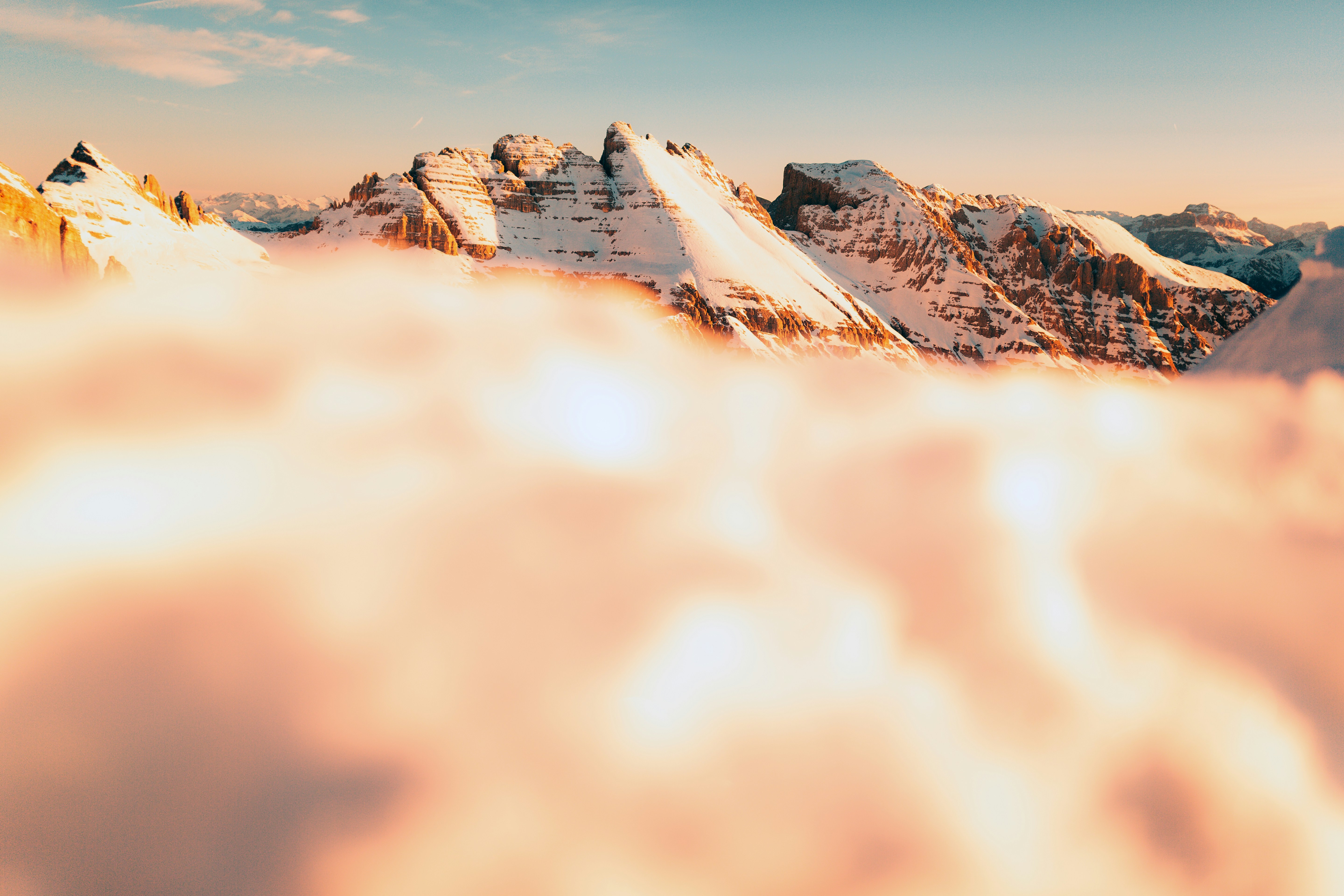 A view of a mountain covered in clouds