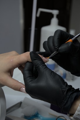 A person getting their nails done at a nail salon