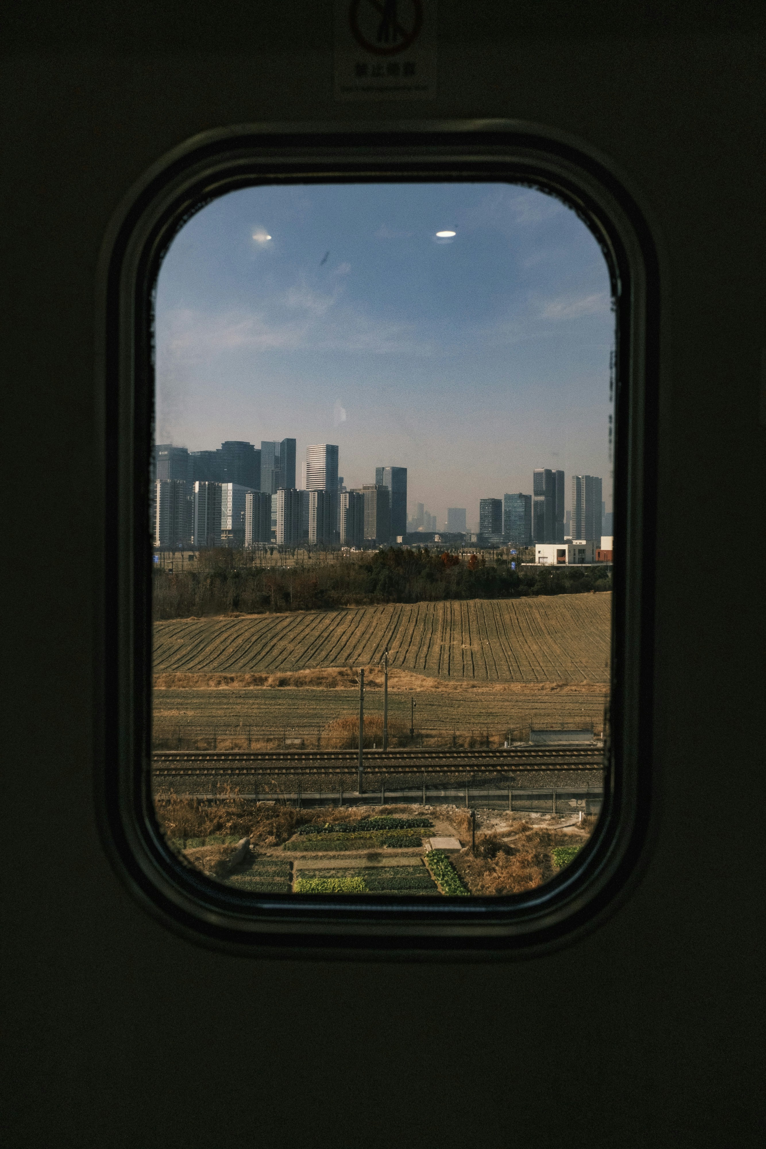 A view of a city from a window of a train photo – Free Cityscape Image ...