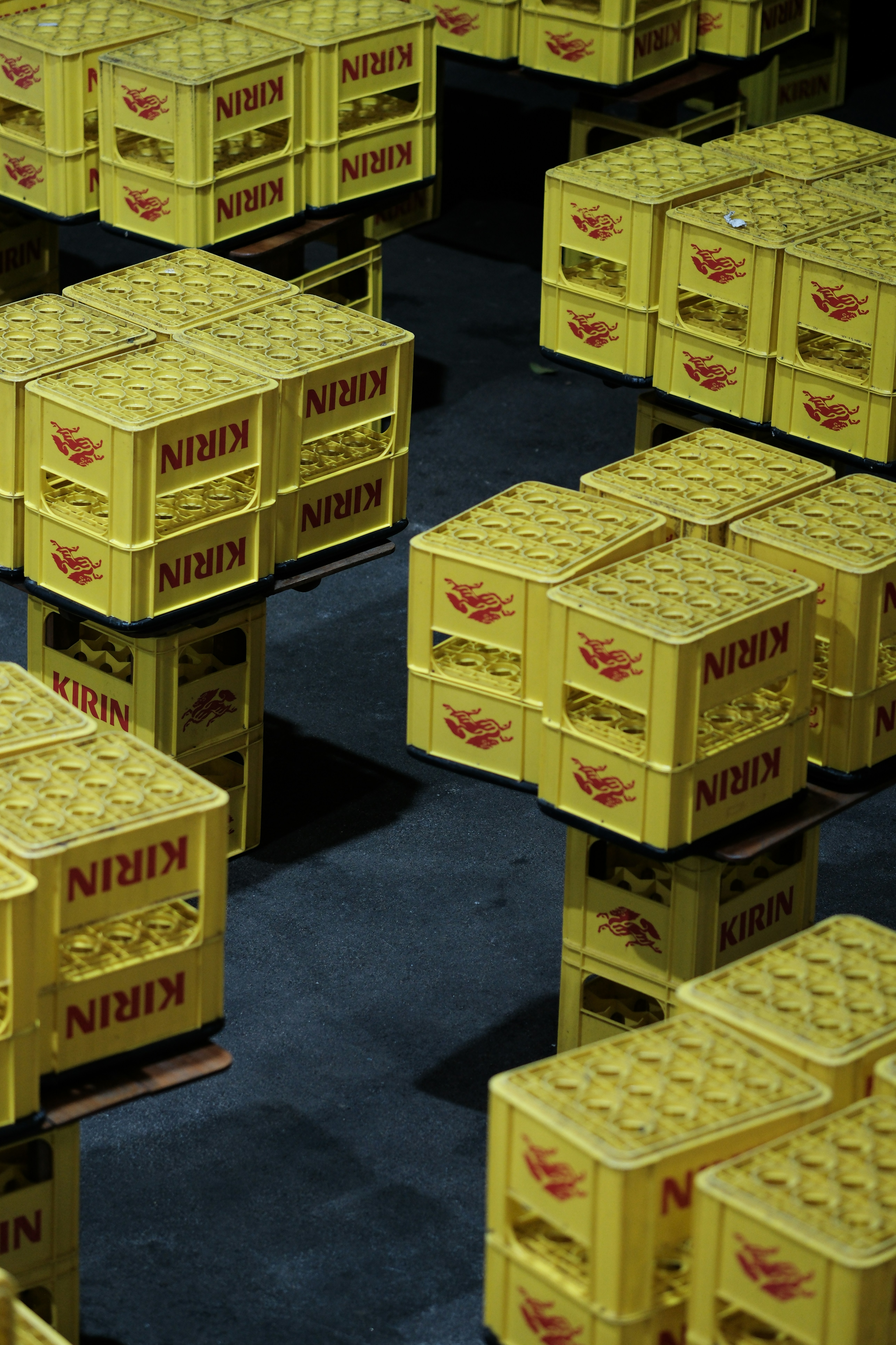 A bunch of yellow crates sitting on top of each other