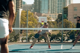 A group of men playing a game of tennis