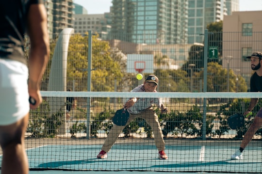 A group of men playing a game of tennis