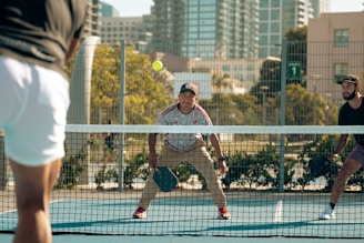 A group of men playing a game of tennis