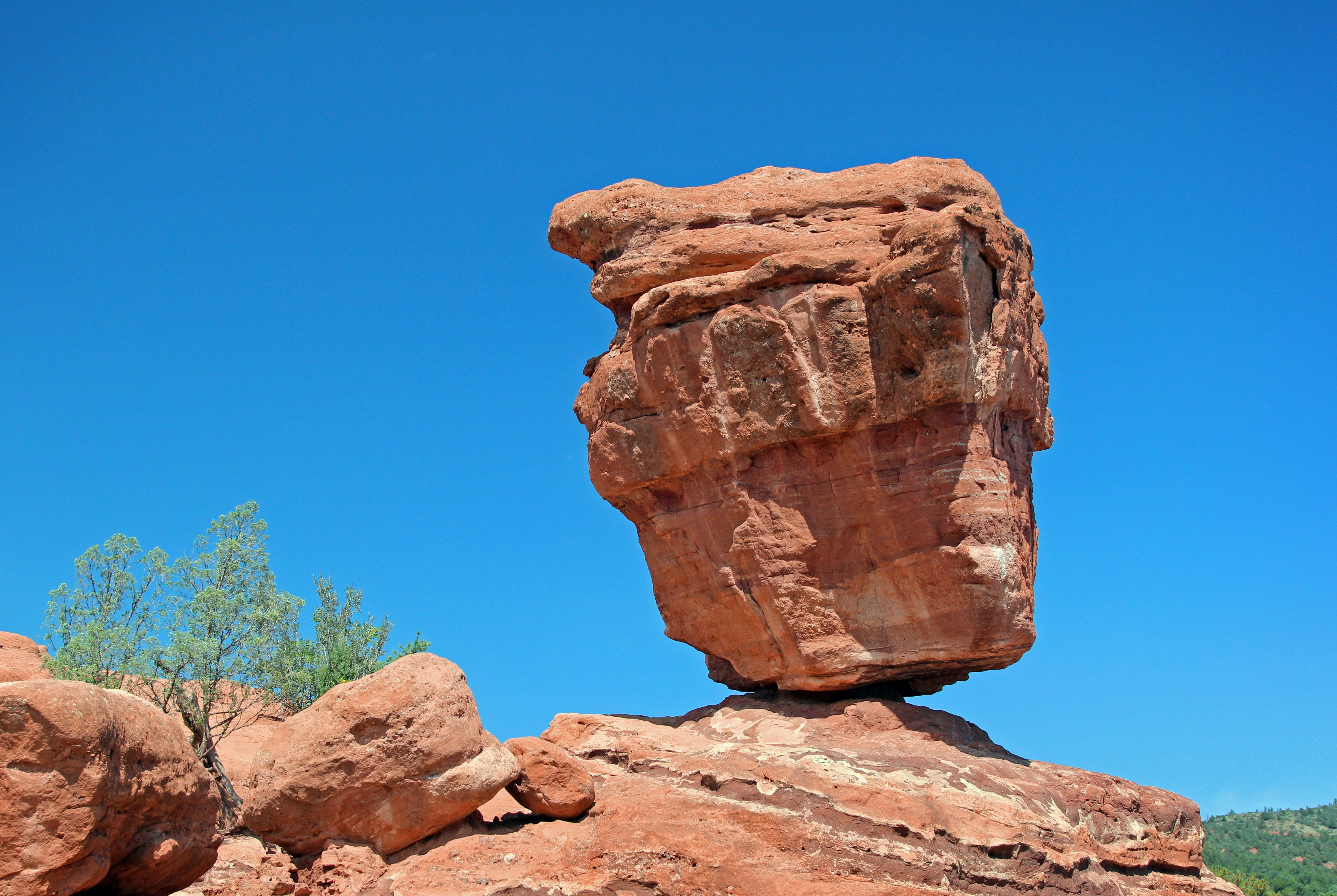 A rock formation in the middle of a desert