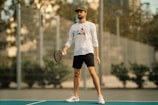 A man standing on a tennis court holding a racquet