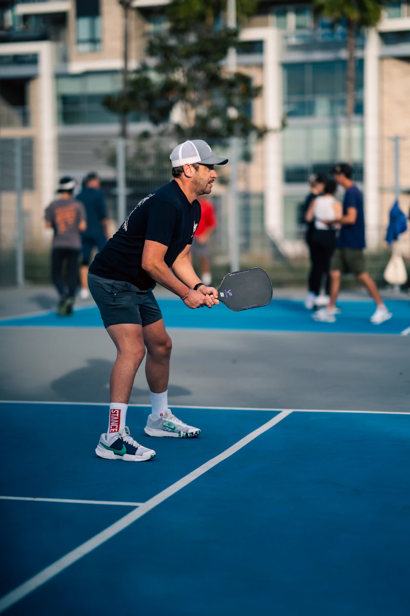 A TYPTI racket and ball on court