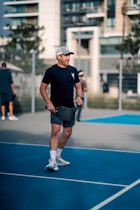 A man standing on a tennis court holding a racquet