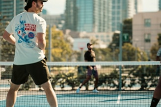 A man standing on a tennis court holding a racquet