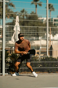 A man standing on a tennis court holding a racquet