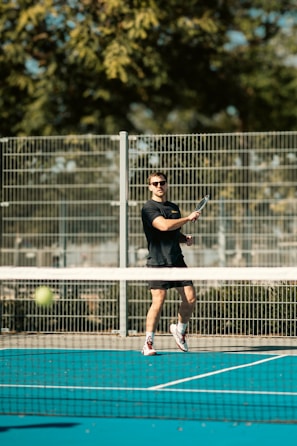 A man swinging a tennis racquet on a tennis court