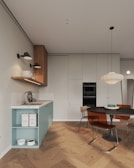A kitchen with a table and chairs and a stove