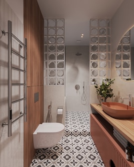 A bathroom with a sink, toilet and mirror