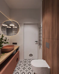 A bathroom with a toilet, sink, and mirror