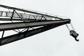 A tall metal structure with a sky background