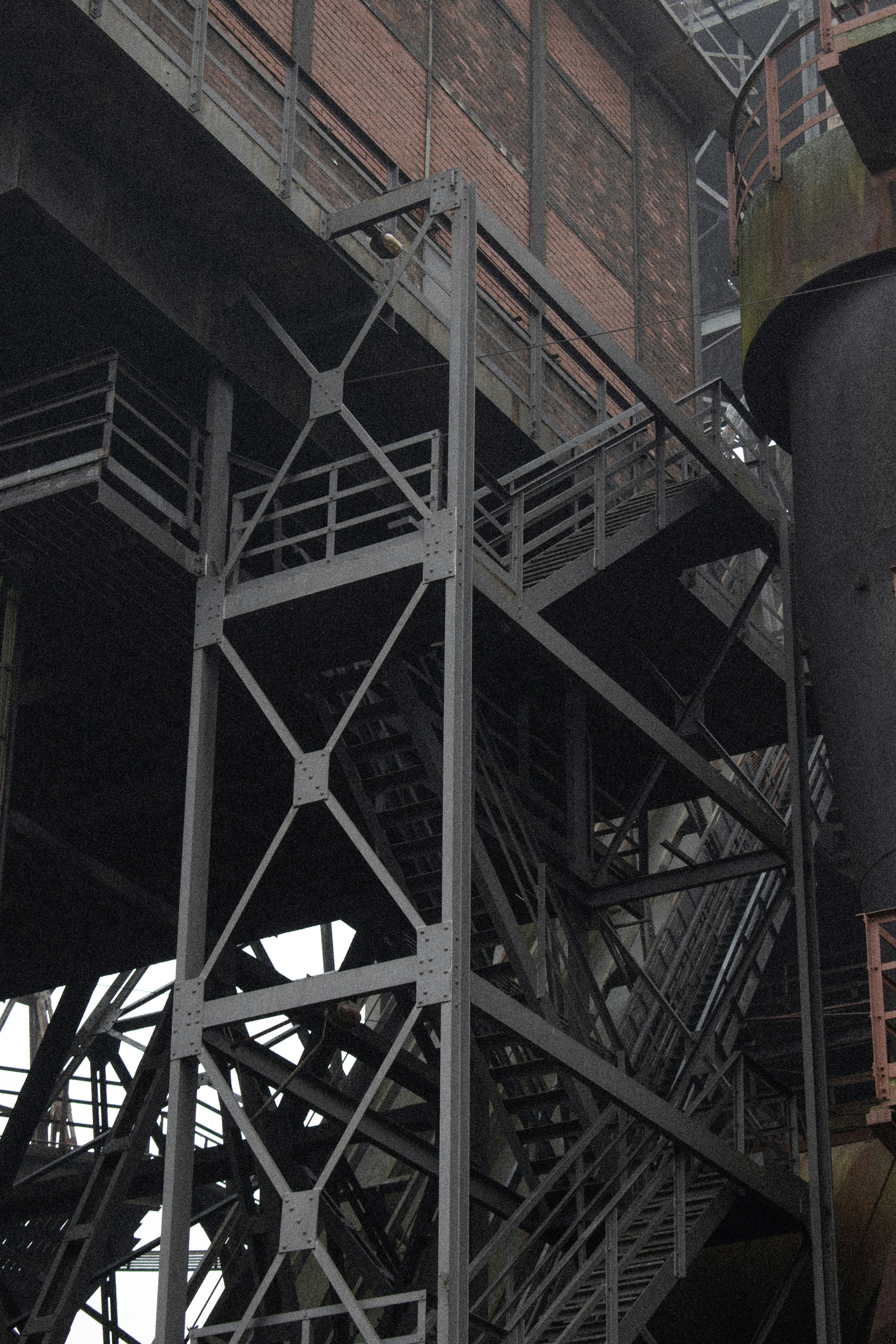 A large metal structure with a clock on it