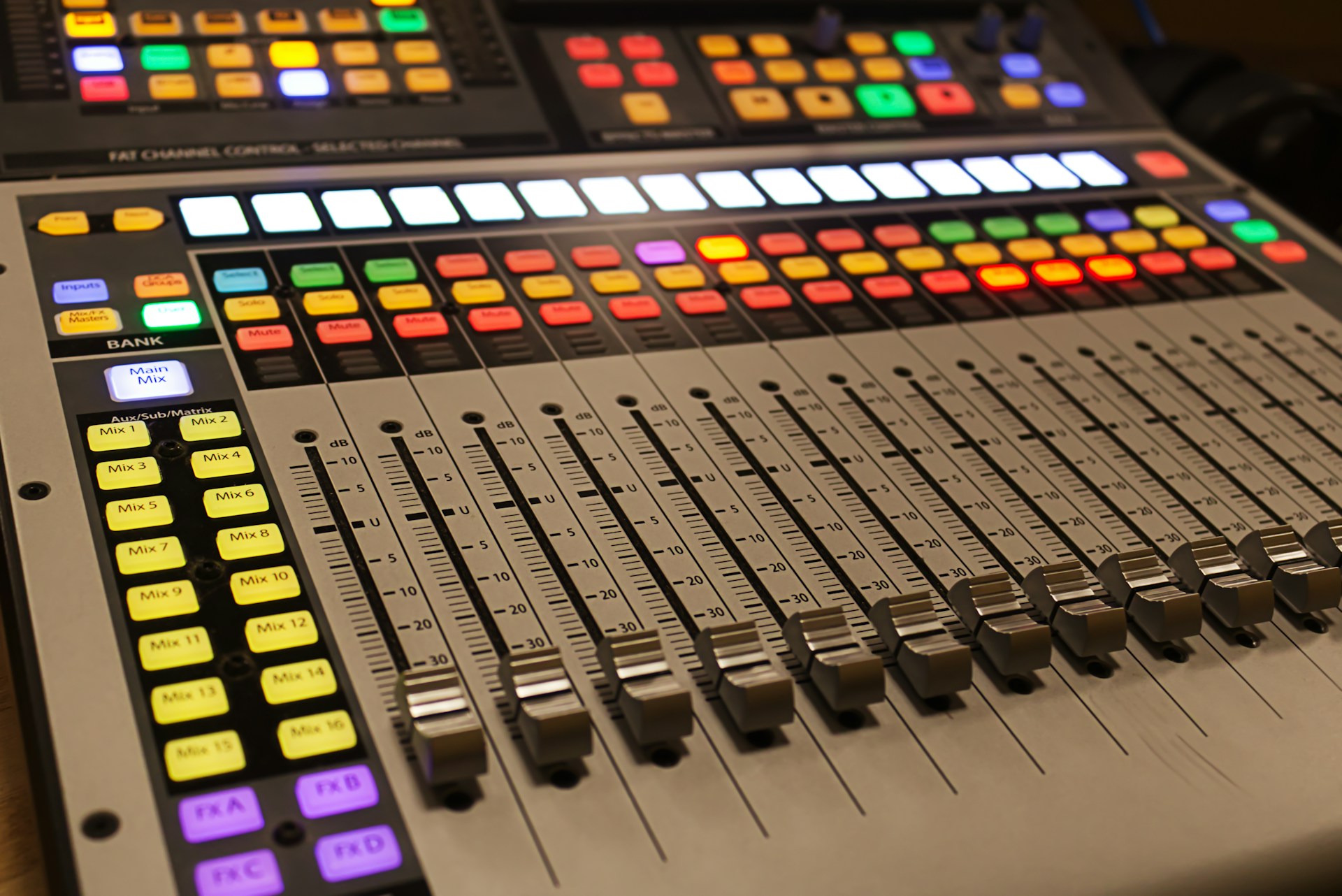 A sound board with many different colored buttons