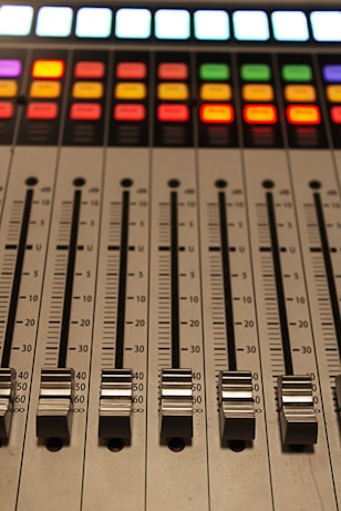 A sound board with a lot of knobs on it