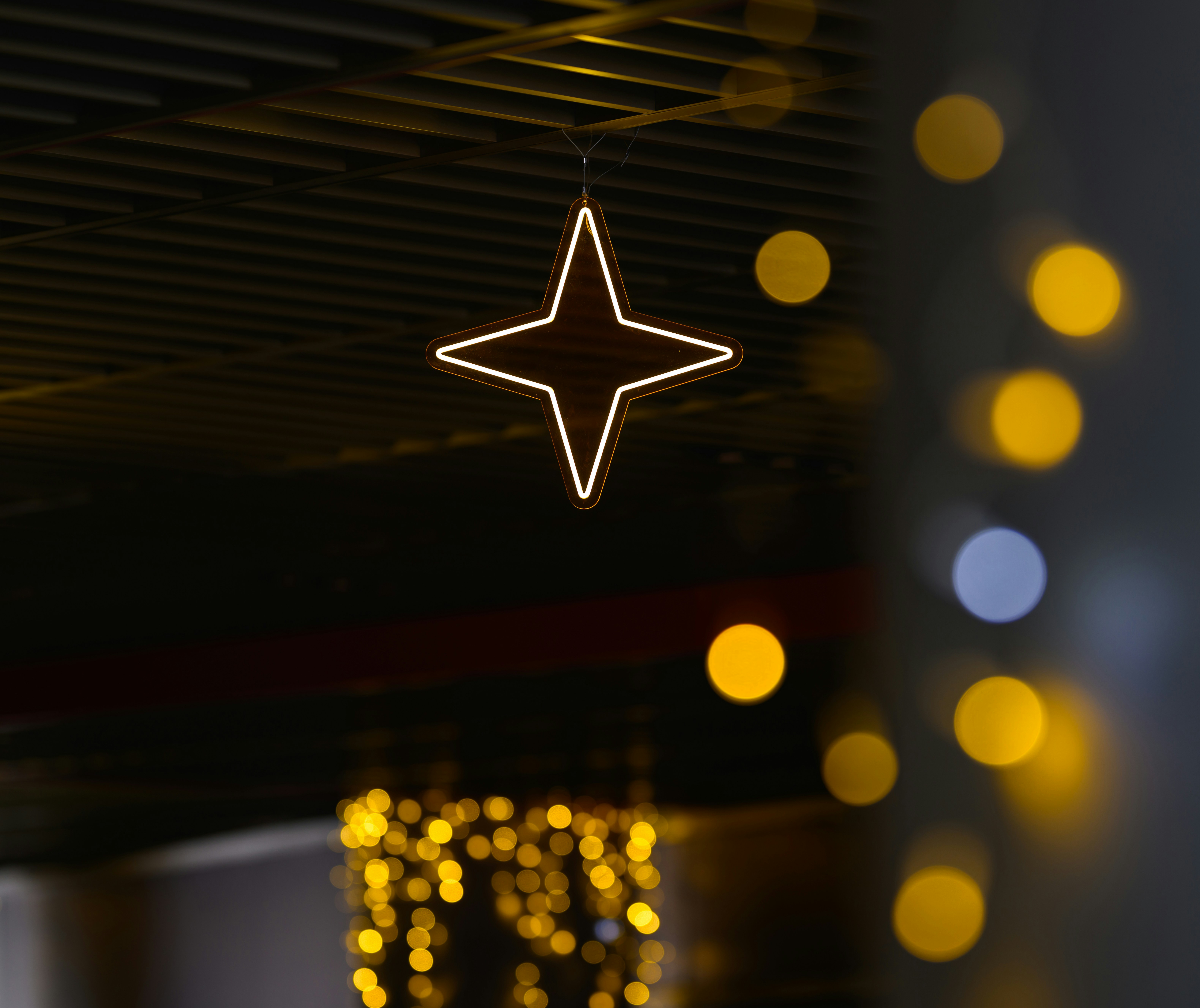 A star hanging from the ceiling of a building