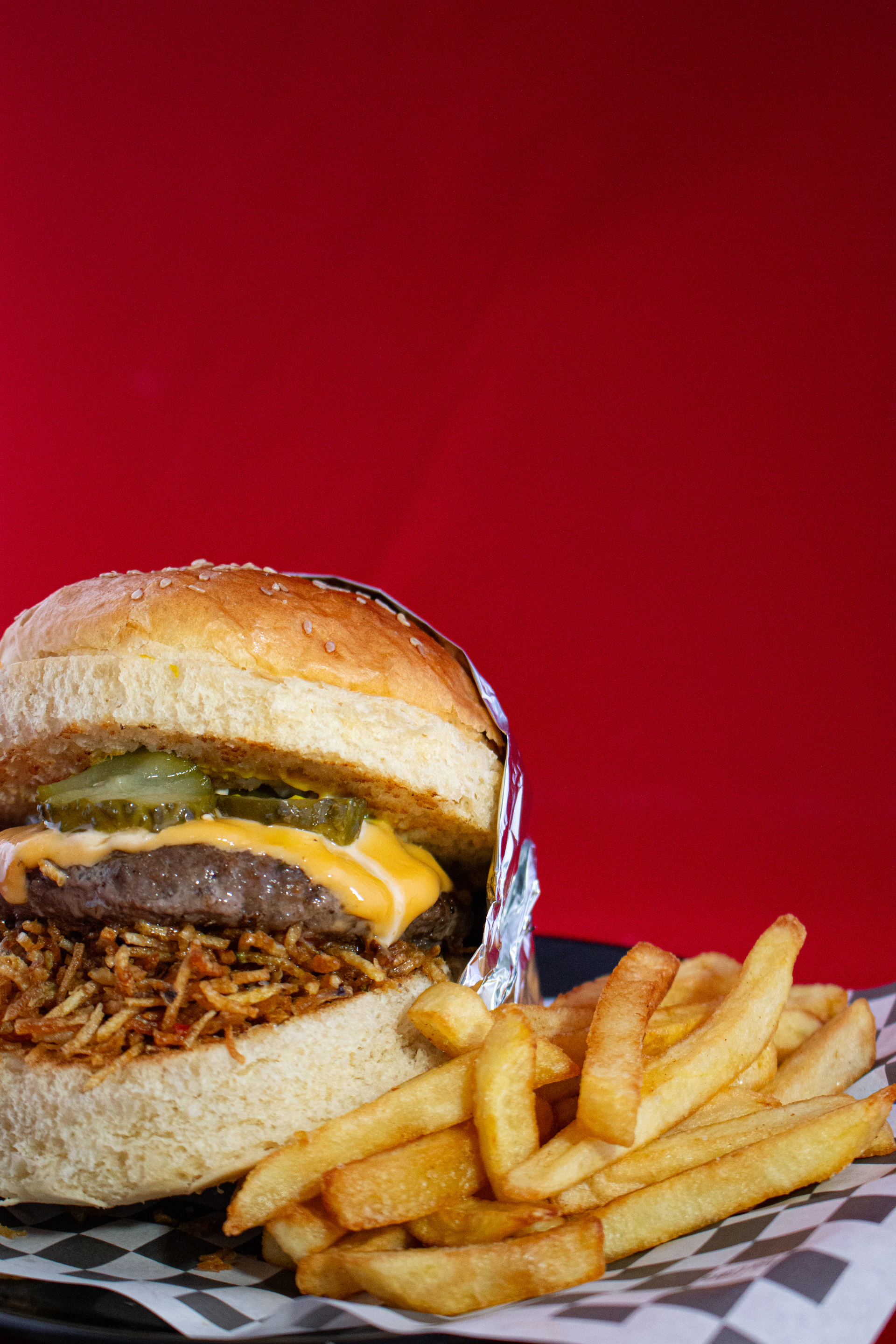 A sandwich and french fries on a tray