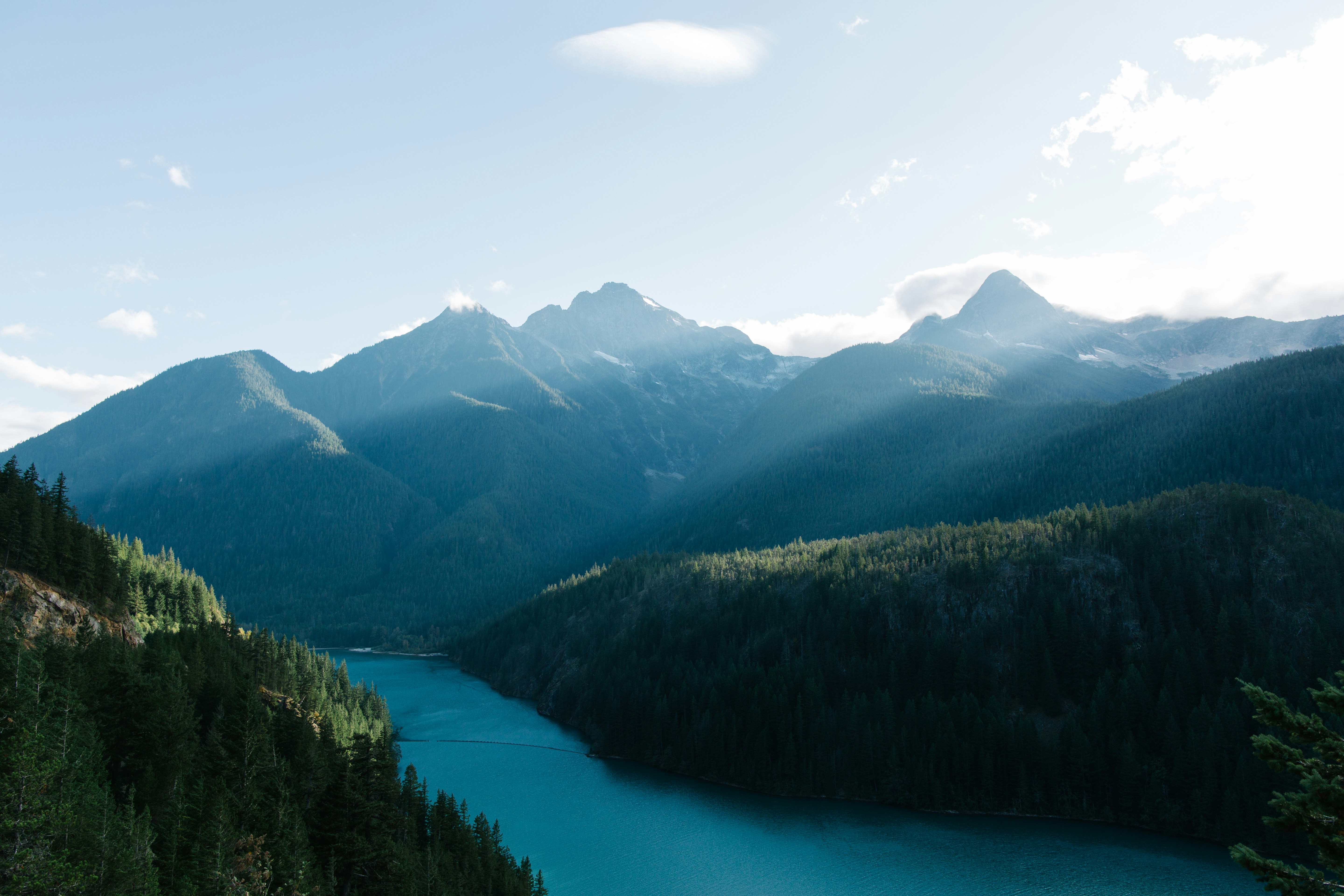 A scenic view of a lake surrounded by mountains
