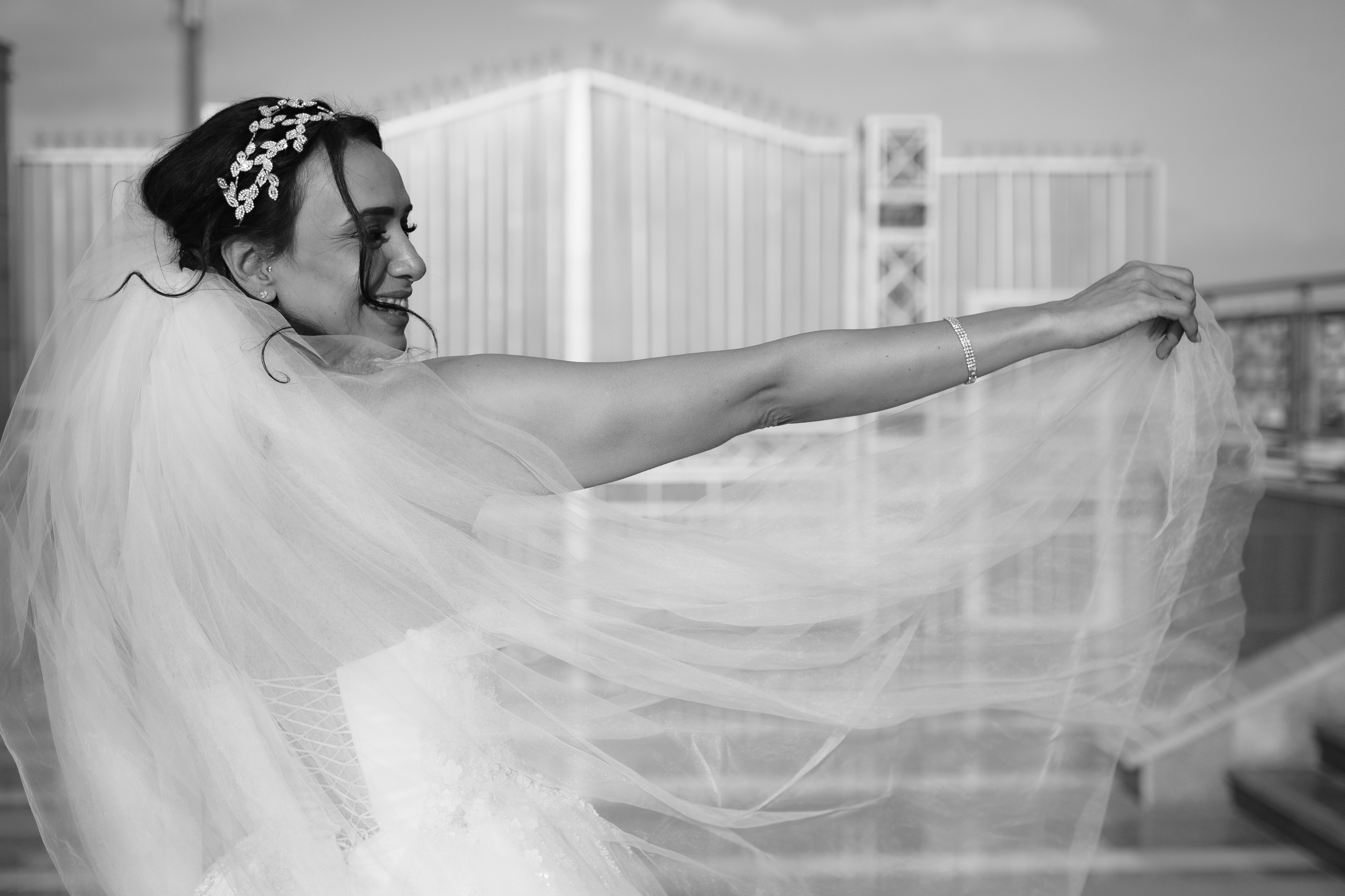 Bride poses with her veil